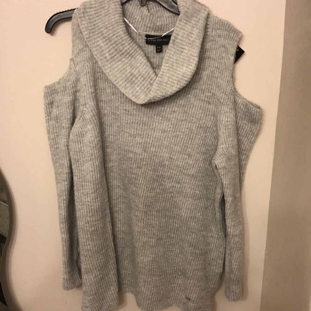 Gray shoulder opening turtle neck sweater.